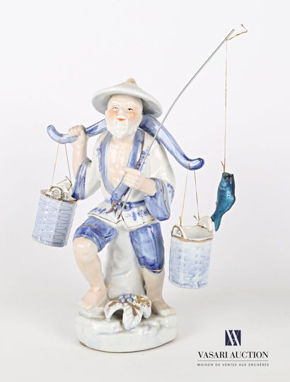 null White porcelain subject tinted blue and gold representing a fisherman supporting...