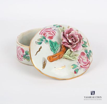 null White porcelain box of oval form with polychrome decoration of flowers treated...