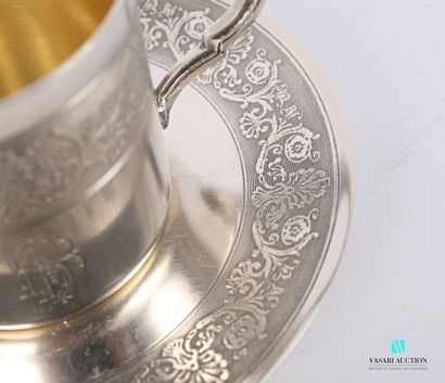 null Cup and its saucer in silver plated metal decorated with a frieze of foliage...