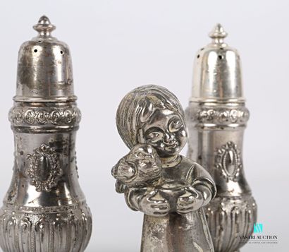 null Lot including a silvered bronze subject representing a young girl with a bird...