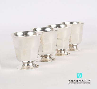 null Suite of four silver plated egg cups on a pedestal base, the notched body in...