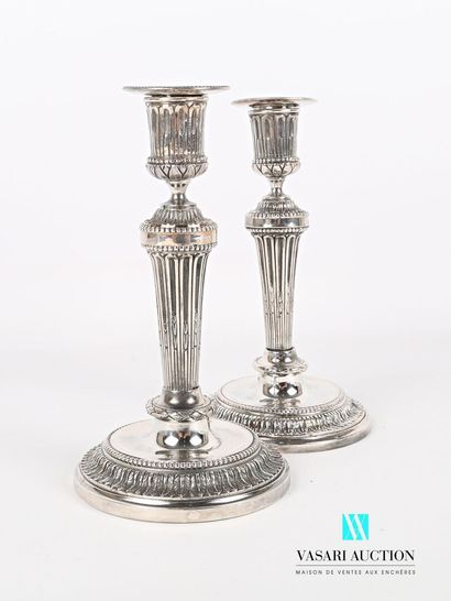 null Pair of silver plated bronze torches standing on a round base with doucine hemmed...