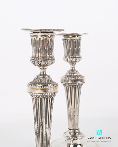 null Pair of silver plated bronze torches standing on a round base with doucine hemmed...