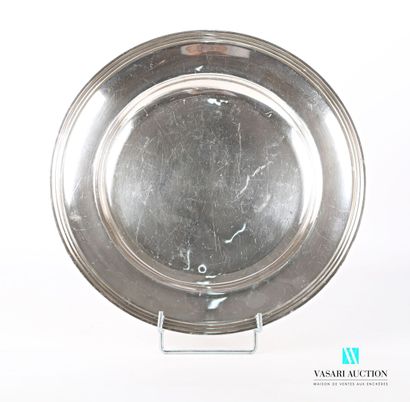 null Round and hollow dish in silver plated metal, the edge hemmed with nets arranged...