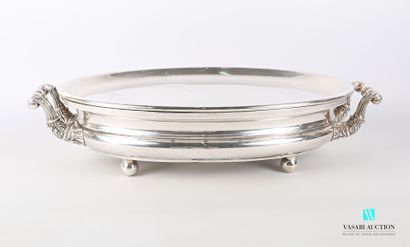 null Silver-plated metal warmer of oblong form posing on four feet balls, the side...