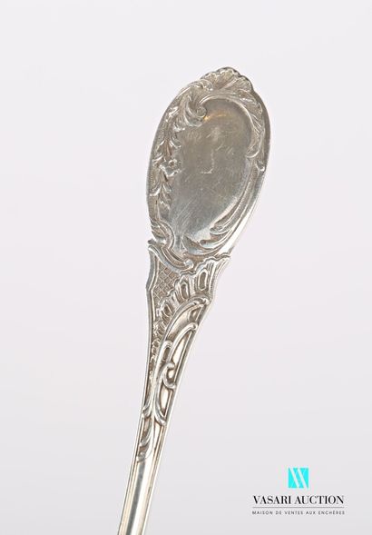 null Silver cream spoon, the handle decorated with flowering branches and foliage,...