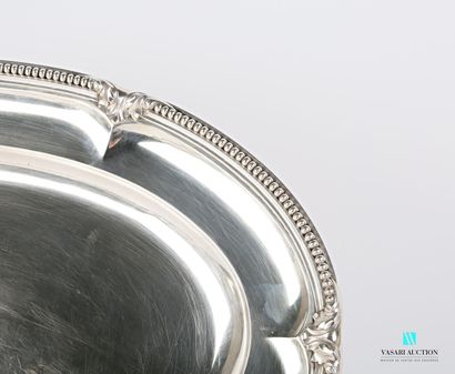 null Oblong silver dish, the border hemmed with a frieze of pearls decorated with...