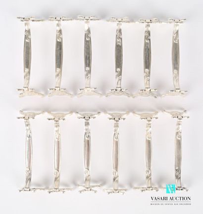 null Suite of twelve silver plated knife holders decorated with foliage, acanthus...