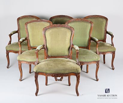 null Suite of six armchairs in molded and carved natural wood, the moving backrest...
