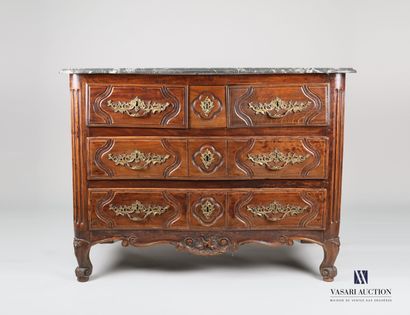 null Chest of drawers in molded and carved natural wood, the front crossbow opens...
