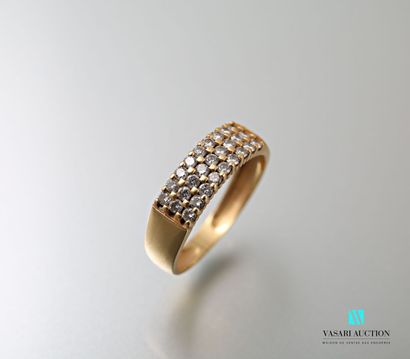 null Ring in yellow gold 750 thousandth set with three rows of nine diamonds of approximately...