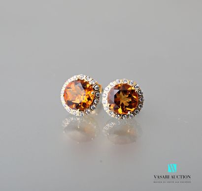 null Pair of earrings in vermeil 925 thousandths set with faceted round orange beryls...