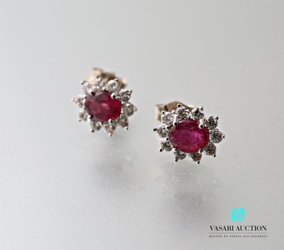null Pair of earrings in white gold 750 thousandth set with two glass field rubies...