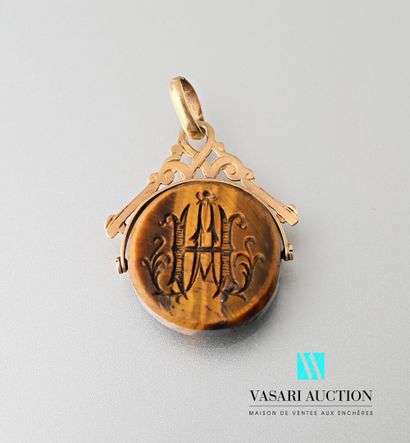 null Pendant set with a tiger's eye quartz intaglio engraved on one side with the...