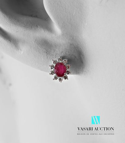 null Pair of earrings in white gold 750 thousandth set with two glass field rubies...