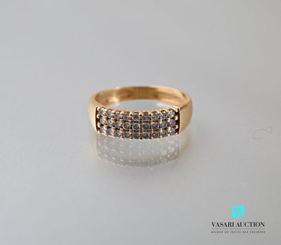 null Ring in yellow gold 750 thousandth set with three rows of nine diamonds of approximately...