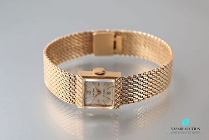 null Montre bracelet de dame en or 750 millième présente un cadran carré à fond champagne...
