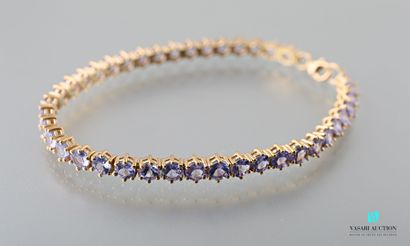 null Flexible bracelet in vermeil 925 thousandths set with facetted round tanzanites...