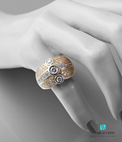 null Dome ring in gold 750 thousandths of two tones paved with diamonds. The central...