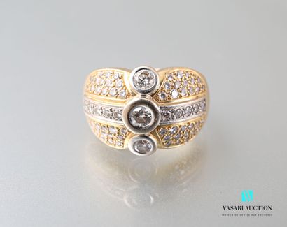 null Dome ring in gold 750 thousandths of two tones paved with diamonds. The central...
