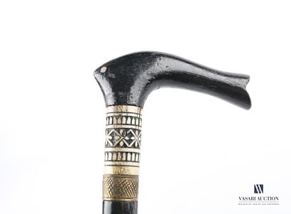 null Walking stick in blackened wood, the Derby knob the cylindrical shaft with carved...