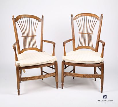 null Pair of armchairs "Bonne femme", the back slightly curved with openwork decoration...