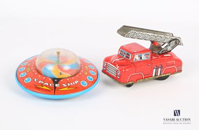 null Lot including a plastic spinning top and a fire truck in lithographed sheet...