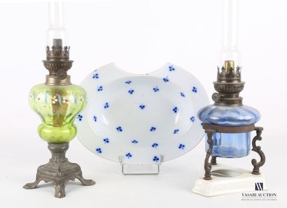 null Lot including two oil lamps, one resting on an earthenware base with a blue...