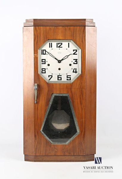 null Wall clock in wood with eight gongs, the octagonal dial marked "Odo" indicates...