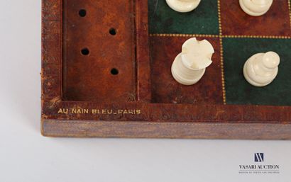 null Box containing a chess set in carved wood, the board covered with leather, the...