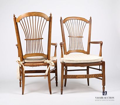 null Pair of armchairs "Bonne femme", the back slightly curved with openwork decoration...
