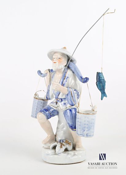  White porcelain subject tinted blue and gold representing a fisherman supporting...