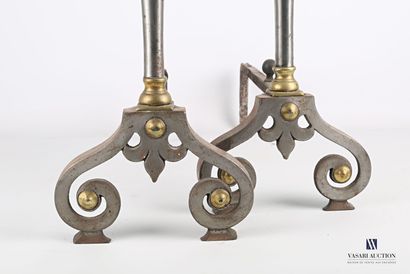 null Pair of wrought iron and bronze andirons, the tubular shaft surmounted by an...
