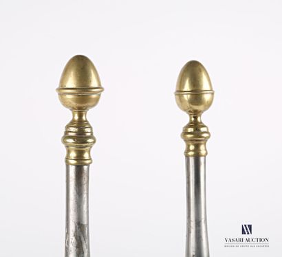 null Pair of wrought iron and bronze andirons, the tubular shaft surmounted by an...