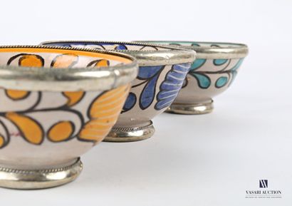  Three glazed terracotta bowls decorated with foliage in yellow, turquoise and blue....