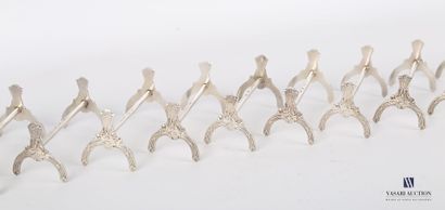 null Suite of twelve silver plated knife holders, the supports decorated with ribboned...
