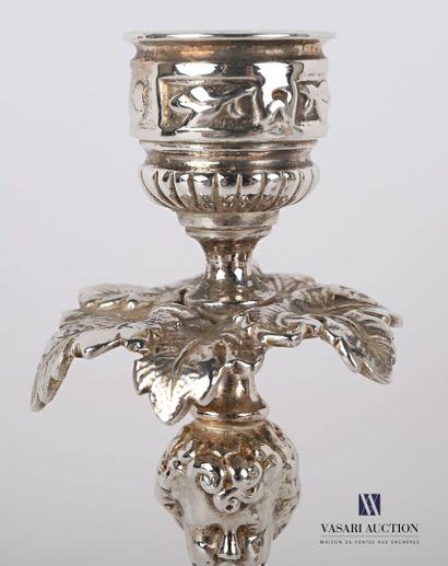 null Pair of silver plated bronze torches standing on a round base with a doucine...