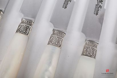 null Set of eight dessert knives, the mother-of-pearl handle is flanked by silver...