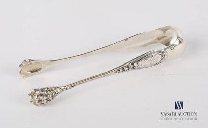 Silver sugar tongs, the arms decorated with...