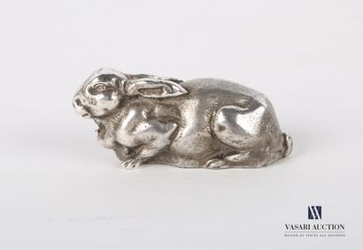 Silver subject representing a rabbit lying...