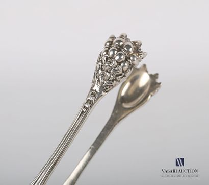 null Silver sugar tongs, the arms decorated with medallions surmounted by leafy clasps...