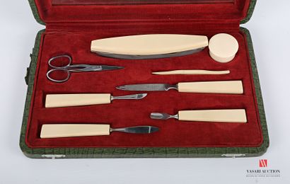 null Nail set in composition in the imitation of ivory comprising eight pieces. In...