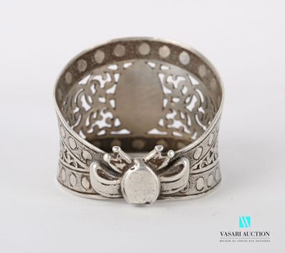 null Silver napkin ring featuring a blind medallion set in an openwork frame of scrolls...