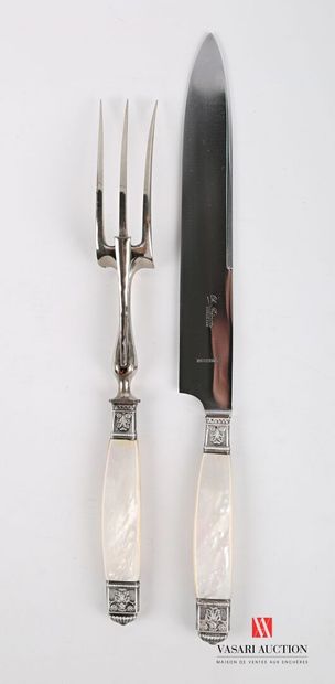 null Cutlery for carving, the mother-of-pearl handle is flanked by silver rings and...