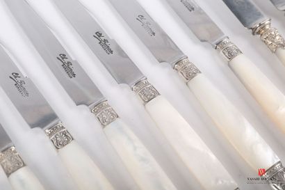 null Set of eight dessert knives, the mother-of-pearl handle is flanked by silver...