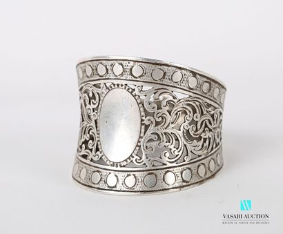 null Silver napkin ring featuring a blind medallion set in an openwork frame of scrolls...