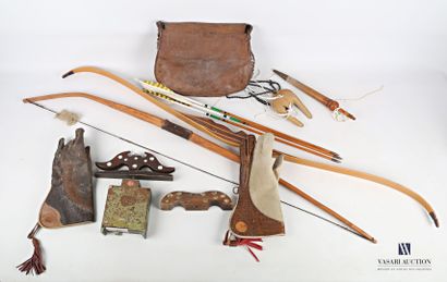 null Lot including two falconer's gloves, two wooden bows, a fawn leather bag, a...