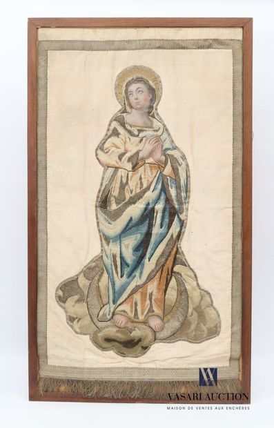 null Silk panel representing a saint in prayer, her habit embroidered with silk and...