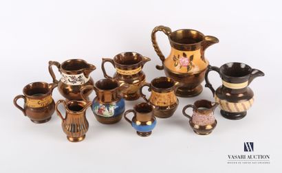 null JERSEY

Lot of ten earthenware jugs with copper enamel decorated with blue bands...