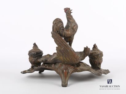 null Inkwell in patinated regula posing on a moving base decorated with waves and...